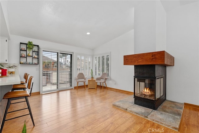 sitting room featuring recessed lighting, baseboards, light wood-style floors, and vaulted ceiling