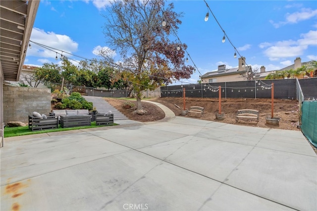 view of patio featuring an outdoor hangout area and a fenced backyard