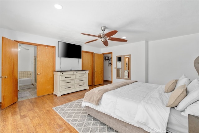 bedroom with recessed lighting, ensuite bath, light wood-type flooring, and a ceiling fan