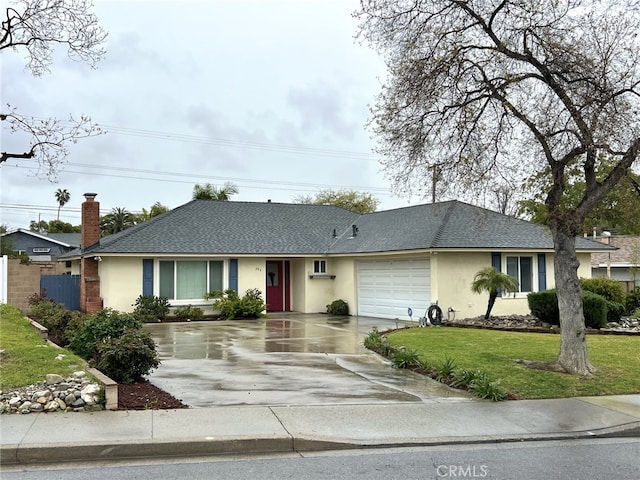 ranch-style home with stucco siding, roof with shingles, concrete driveway, an attached garage, and a front yard