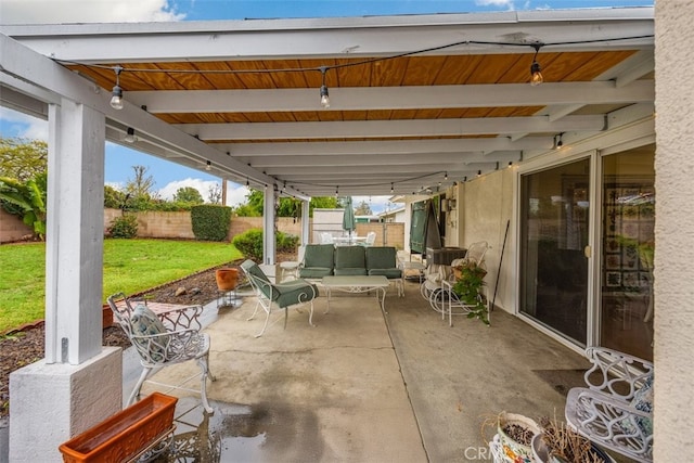 view of patio featuring an outdoor living space and a fenced backyard