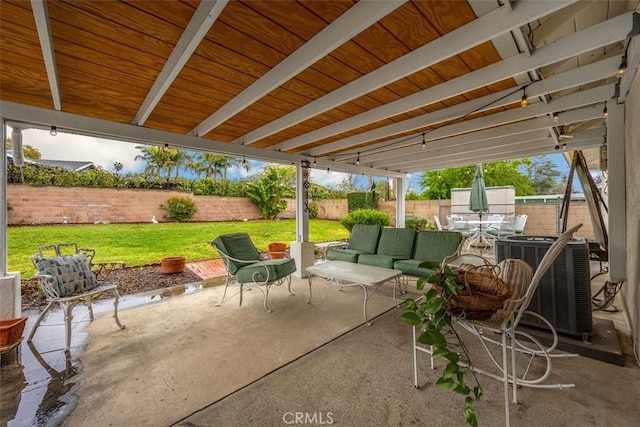 view of patio / terrace with an outdoor living space, central AC unit, and a fenced backyard