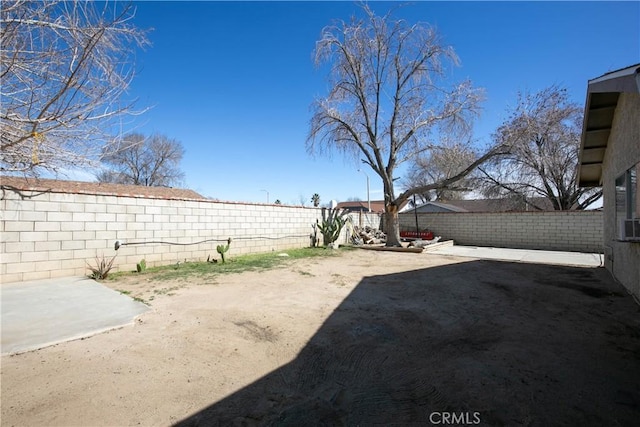 view of yard with a patio and a fenced backyard