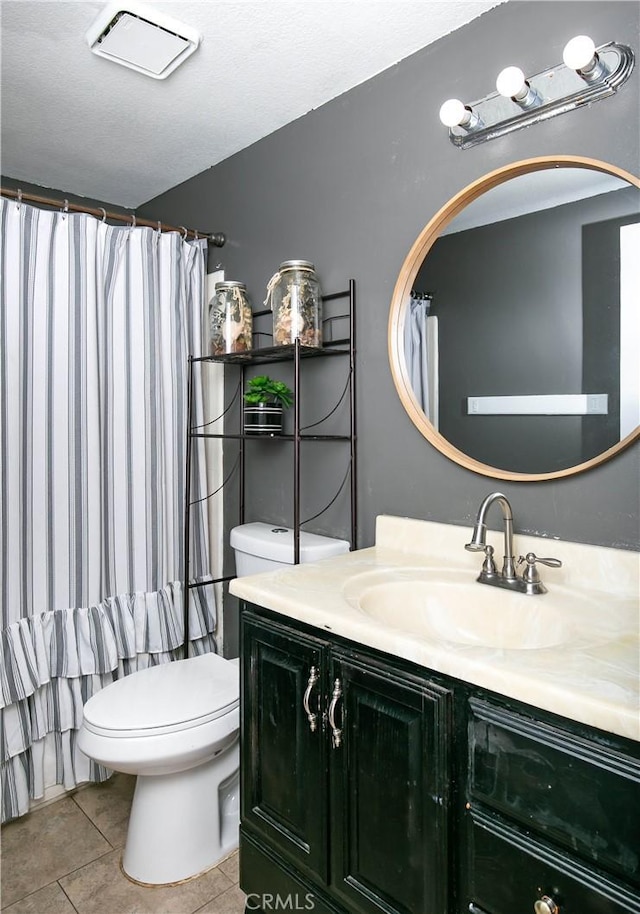 full bath featuring vanity, tile patterned floors, curtained shower, and toilet