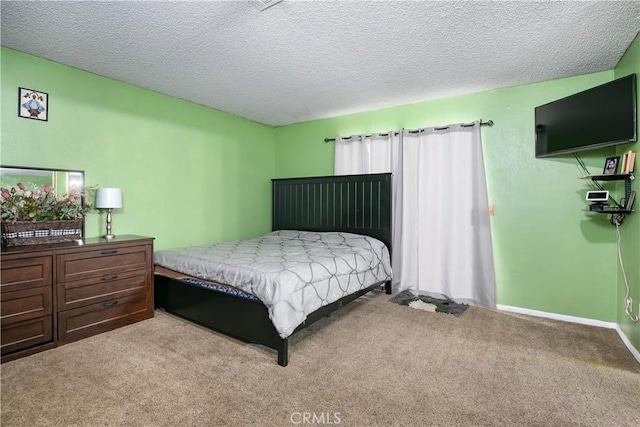 carpeted bedroom with a textured ceiling