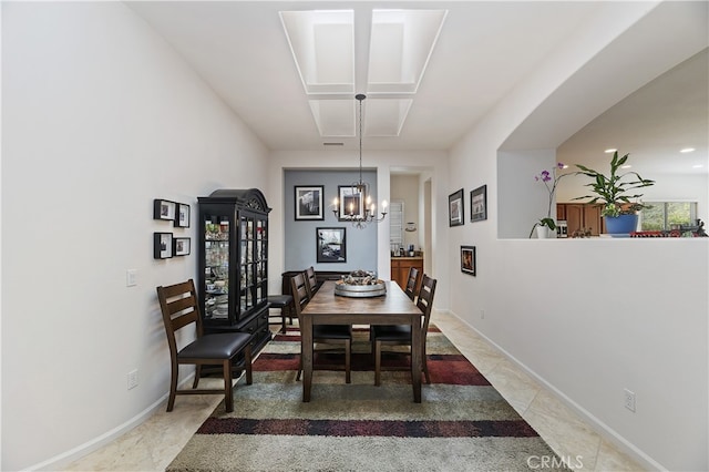 dining area featuring recessed lighting, baseboards, a notable chandelier, and light tile patterned floors