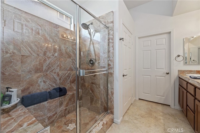bathroom featuring vanity and a stall shower