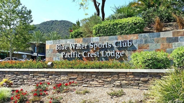 community sign featuring a mountain view