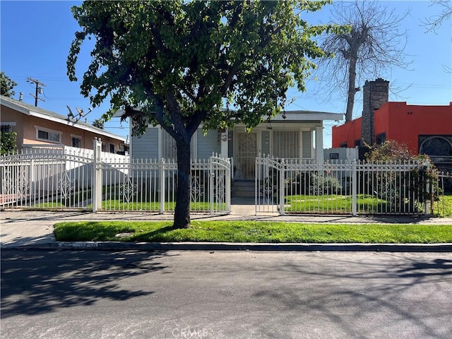 view of front of house with fence private yard and a gate