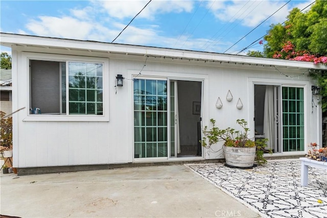 rear view of house featuring a patio
