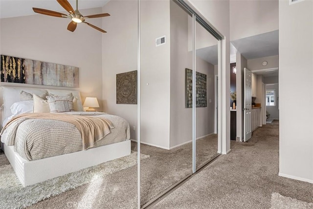 bedroom with baseboards, carpet, visible vents, and high vaulted ceiling