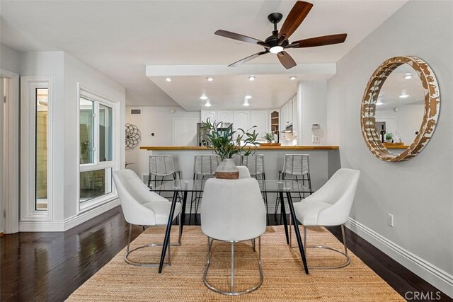 dining area with ceiling fan, baseboards, wood finished floors, and recessed lighting