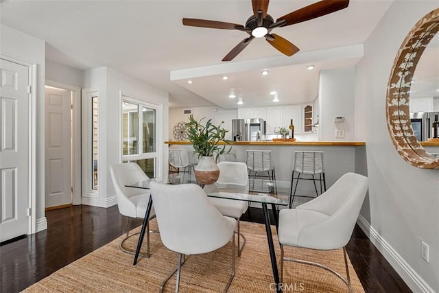 dining room with recessed lighting, baseboards, wood finished floors, and a ceiling fan