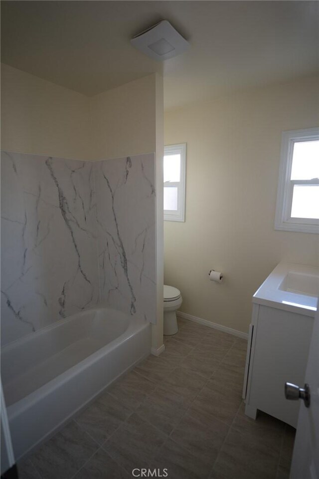 full bath featuring baseboards, toilet, and vanity