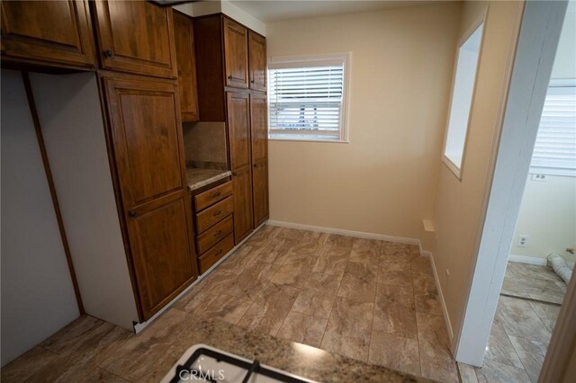 kitchen featuring baseboards