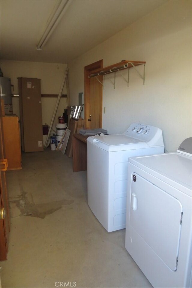 laundry area featuring attic access and washing machine and dryer