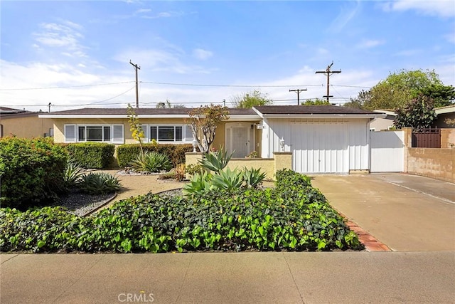 single story home featuring fence