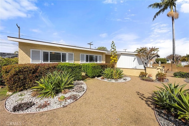 view of front of home featuring stucco siding