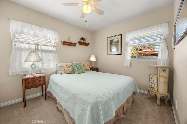 bedroom featuring baseboards, carpet, and a ceiling fan