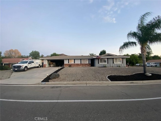 ranch-style home with an attached garage and driveway