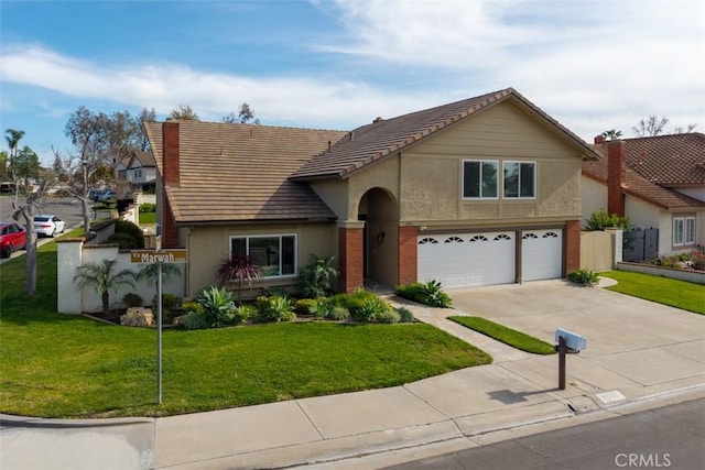 view of front of property featuring driveway, an attached garage, stucco siding, a front lawn, and a tile roof