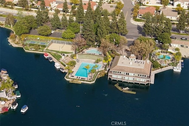 birds eye view of property with a water view and a residential view