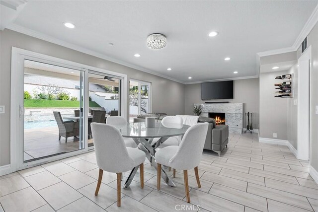 dining room with crown molding and baseboards