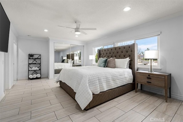 bedroom featuring a ceiling fan, a textured ceiling, recessed lighting, crown molding, and baseboards