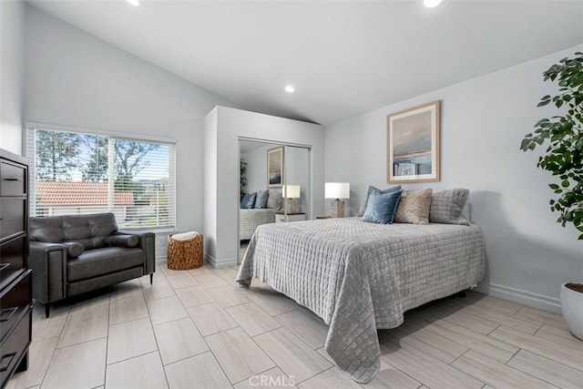 bedroom with recessed lighting, a closet, lofted ceiling, and baseboards