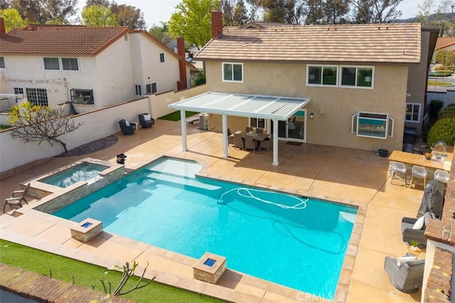 view of swimming pool featuring a patio area, fence private yard, an outdoor living space, and outdoor dry bar