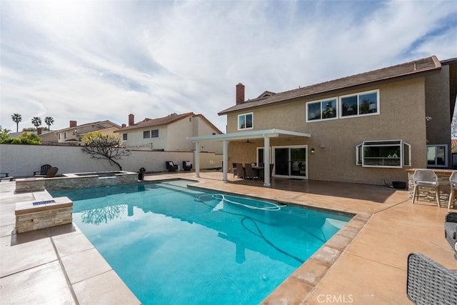 view of pool with outdoor dining space, a patio, fence, and ceiling fan