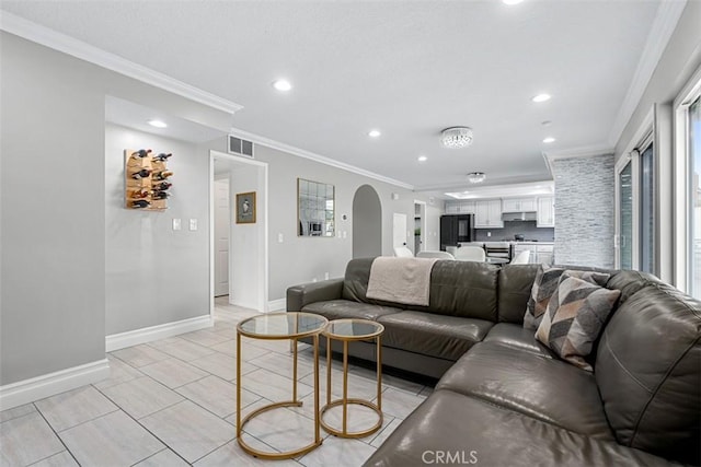 living area featuring crown molding, recessed lighting, baseboards, and visible vents