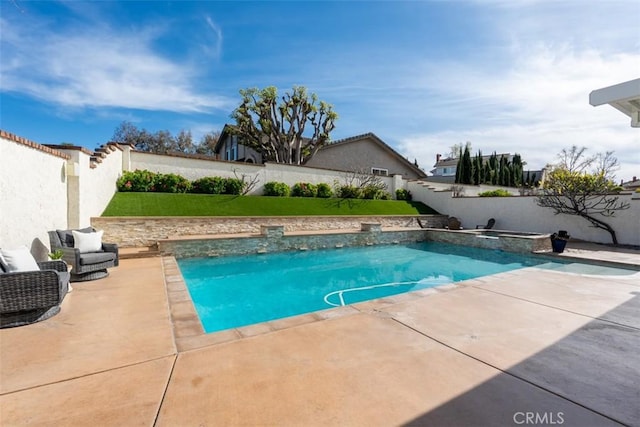 outdoor pool featuring a patio area and a fenced backyard