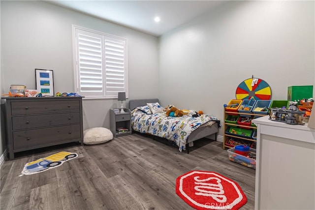 bedroom with wood finished floors