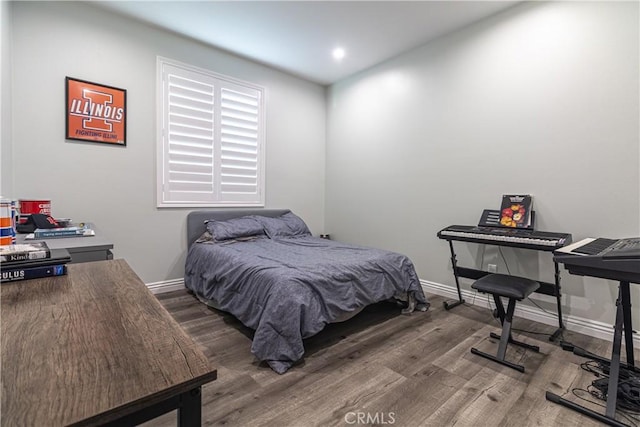 bedroom featuring recessed lighting, baseboards, and wood finished floors