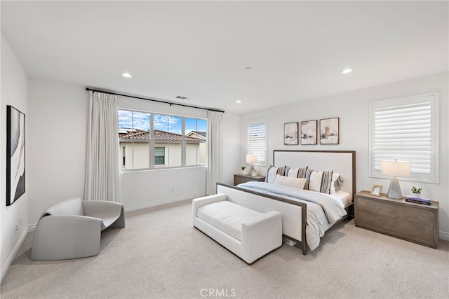 carpeted bedroom featuring visible vents, recessed lighting, and baseboards