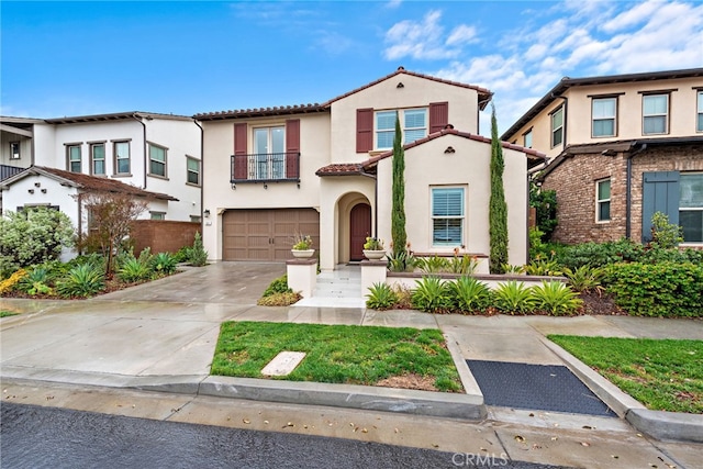 view of front of house featuring a balcony, stucco siding, concrete driveway, a garage, and a tiled roof