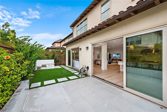 view of patio featuring fence