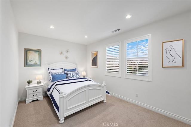 bedroom with carpet flooring, recessed lighting, visible vents, and baseboards