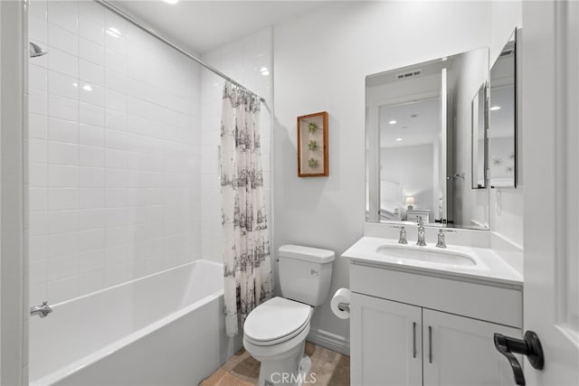 full bath featuring vanity, toilet, shower / bathtub combination with curtain, and visible vents