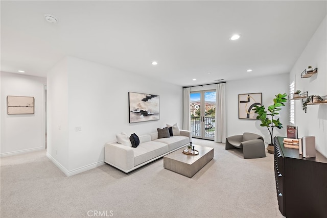 living area featuring recessed lighting, baseboards, and carpet floors