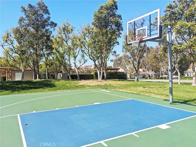 view of sport court featuring community basketball court and a lawn