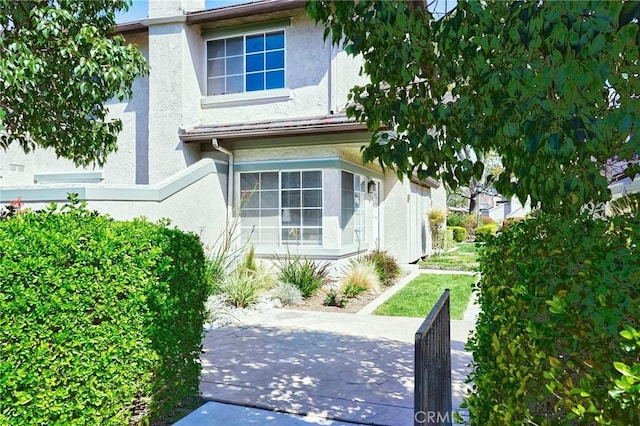 exterior space with stucco siding