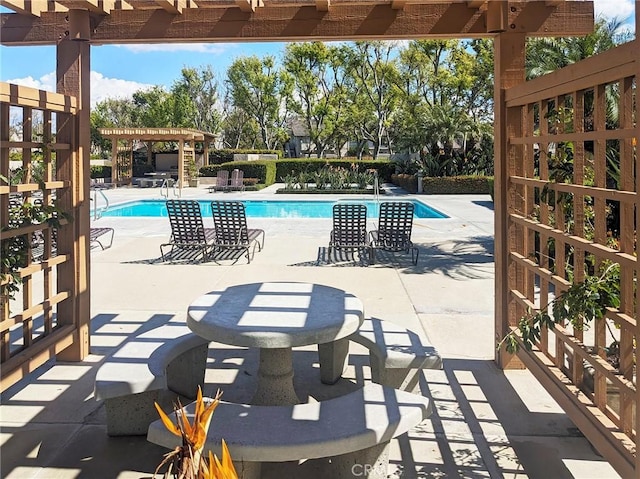 pool featuring a patio and a pergola