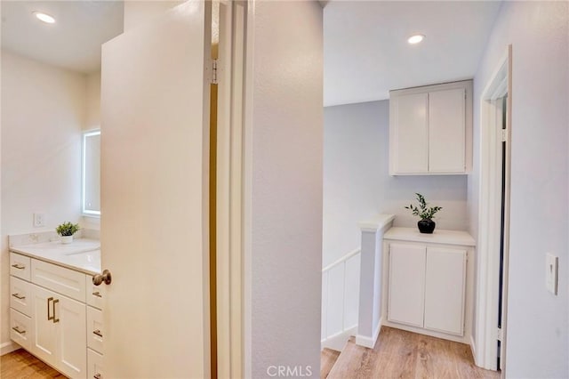 hallway with recessed lighting and light wood-type flooring