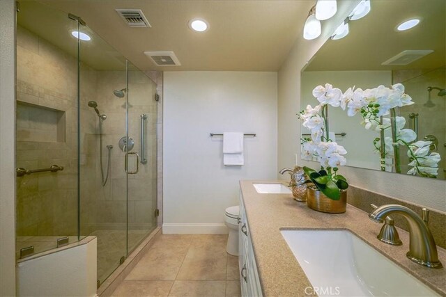 bathroom with a sink, visible vents, and double vanity