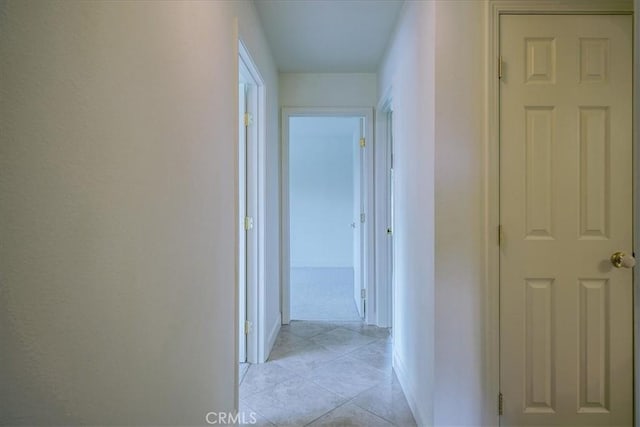 hall with light tile patterned flooring