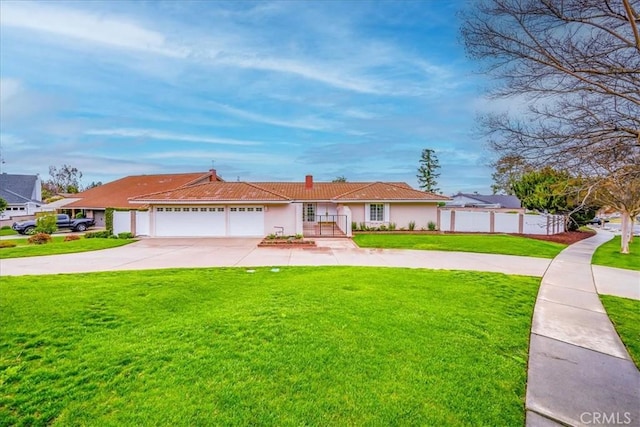 ranch-style home with a front lawn, fence, a tiled roof, driveway, and an attached garage