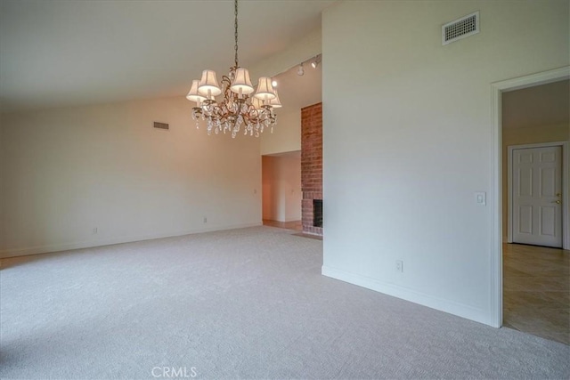 unfurnished room with a notable chandelier, visible vents, and light colored carpet