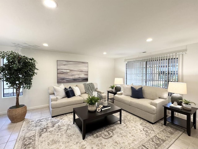 living area with light tile patterned floors, recessed lighting, and baseboards